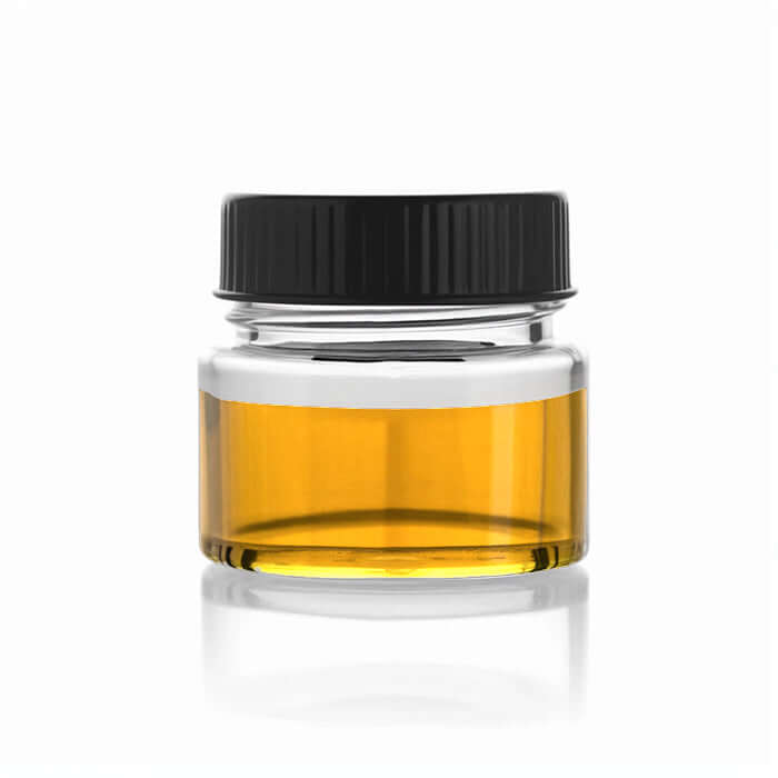 Golden HHC Distillate oil in clear glass jar for tinctures, topicals, edibles, and vape formulations — bulk hemp cannabinoid extract for CBD, CBN, CBT, and CBG products